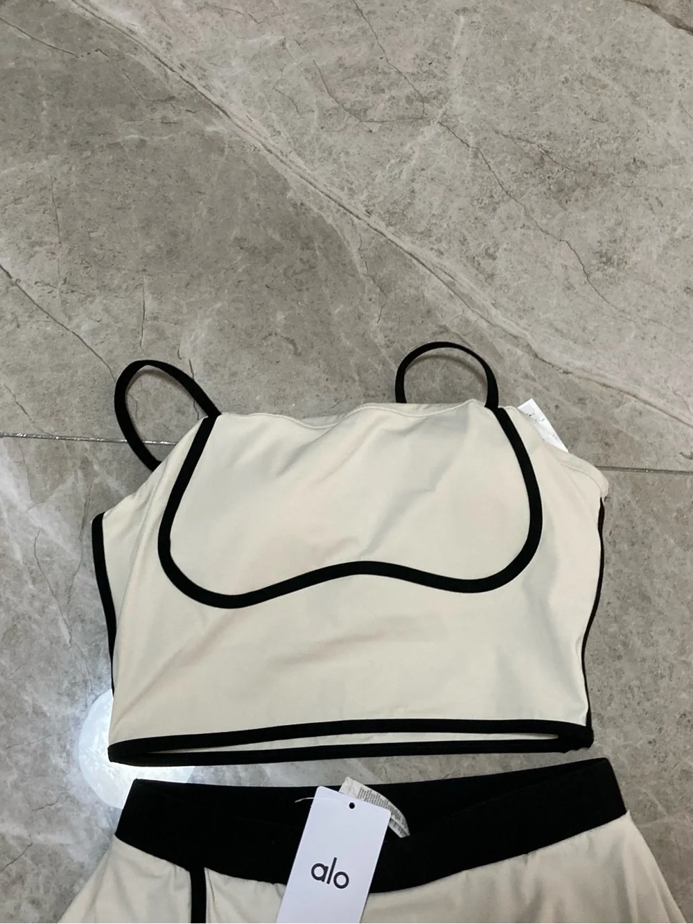 ALO Yoga Cream Two-Piece Crop Top and Skirt with Black Trim